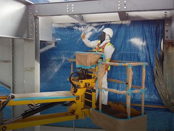 Intumescent paint spraying of structural steel beams